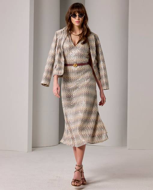Models wearing a sequin dress with matching jacket and belt.