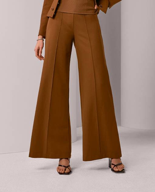 Models wearing a brown wide leg pant.