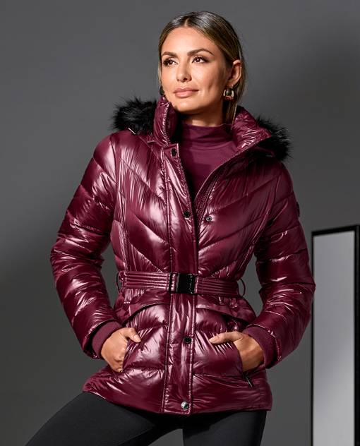 models wearing burgundy puffer jacket with black faux fur collar