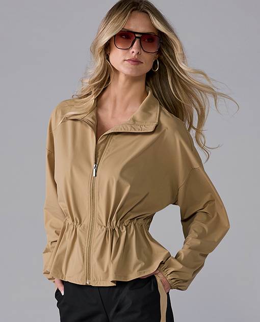 models wearing tan athleisure jacket