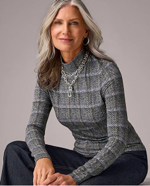 Models wearing a long sleeve and turtleneck top.