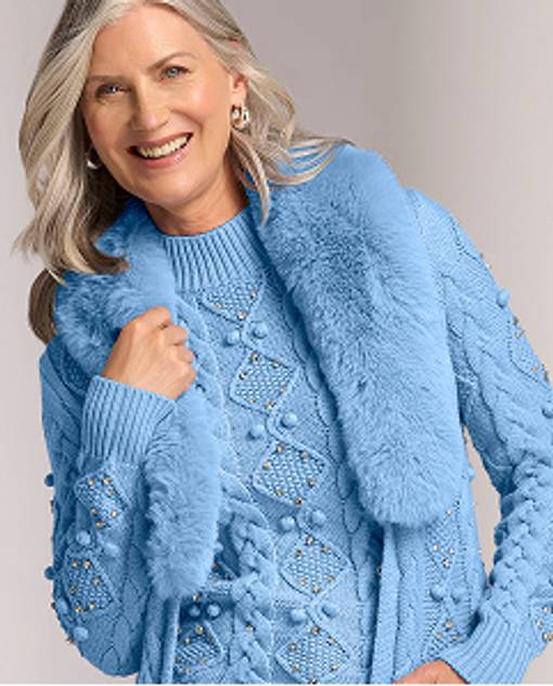 model wears blue sweater