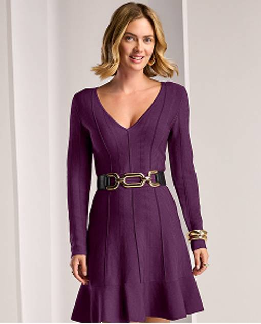 model wears plum colored dress