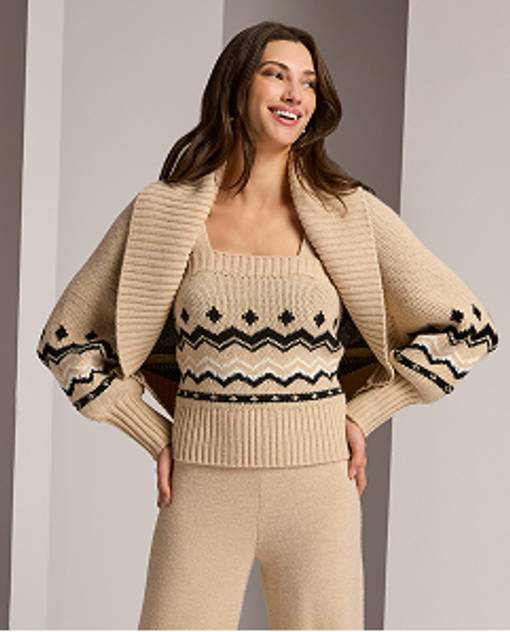 model wears tan and black matching athleisure set