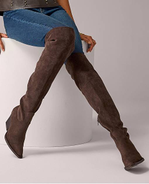 Models wearing a high rise boot