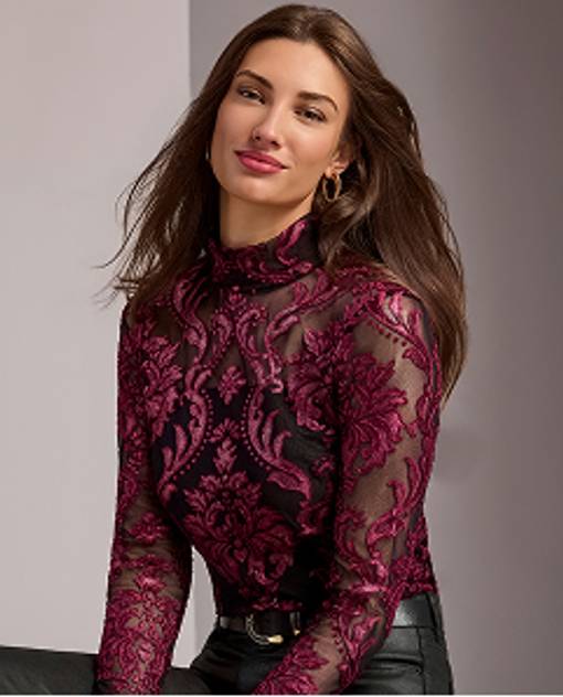 Models wearing a wine colored turtleneck top.