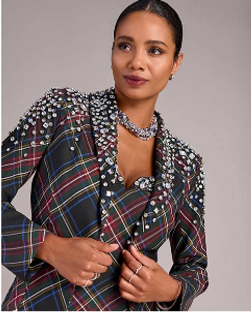 Models wearing a plaid blazer with jewel embellishments.