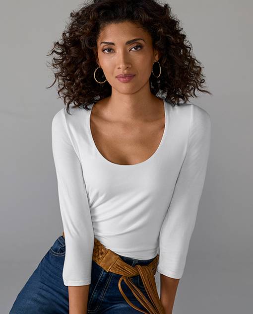 Models wearing a white long sleeve top