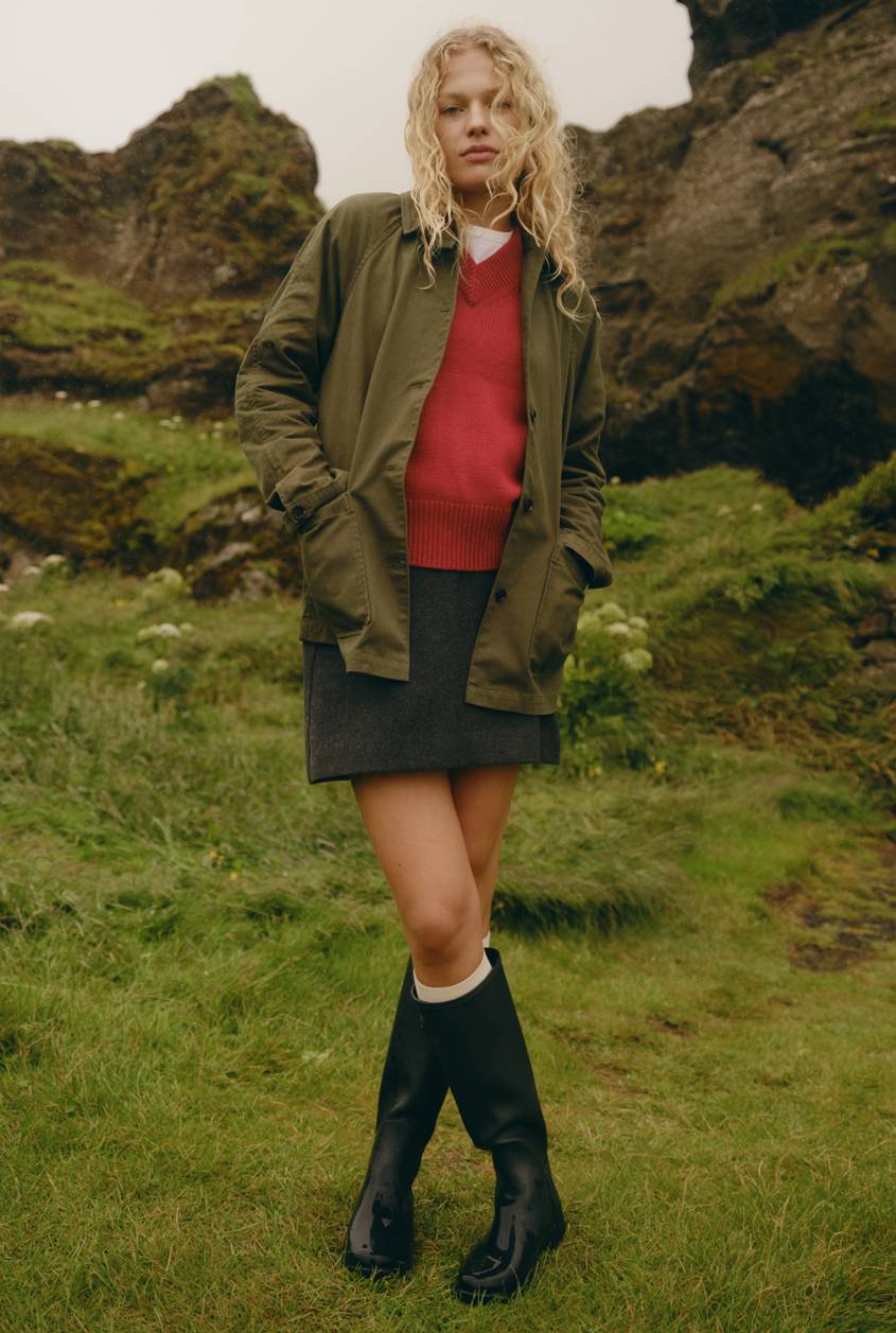 Stafford Jacket in Olive shown on a model to showcase the lightweight material, button-front design, and relaxed fit. Full Body View Featured on Model.