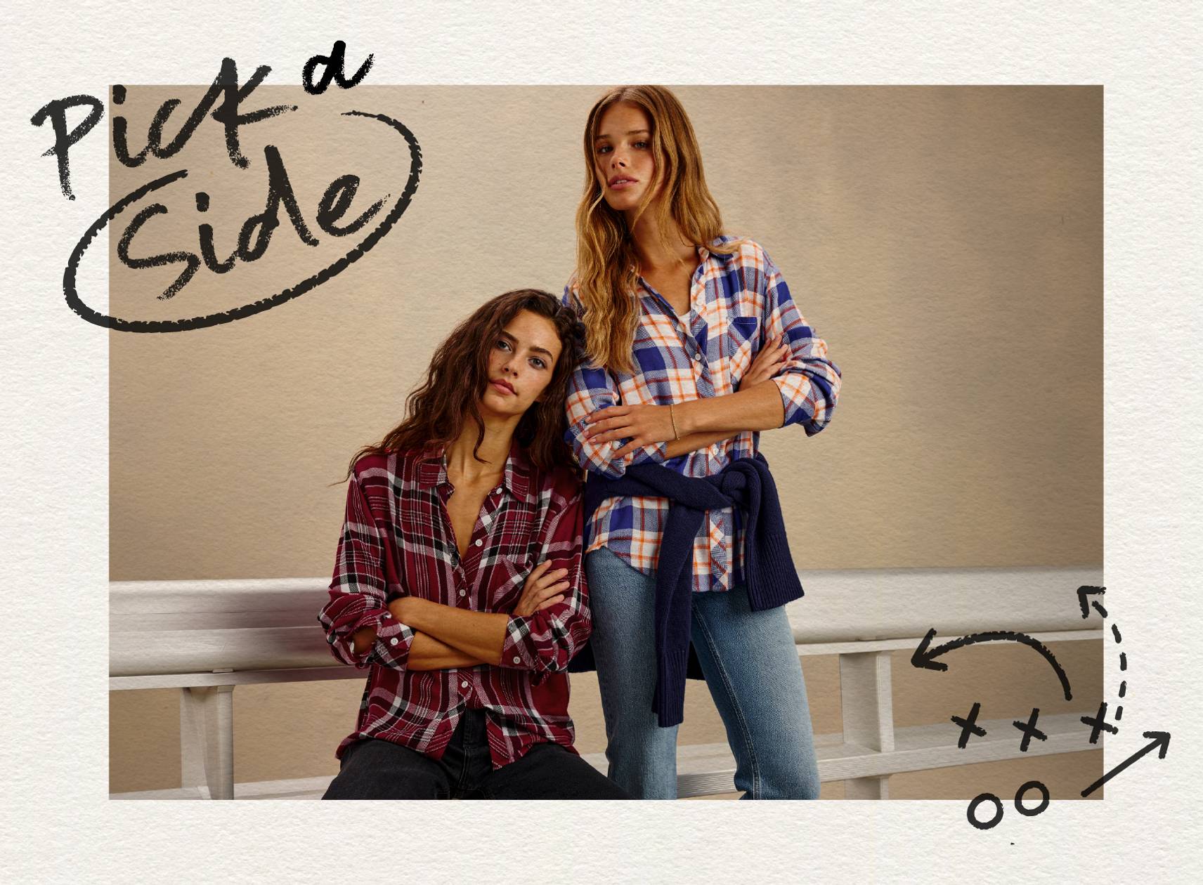 Two women wearing plaid shirts and jeans, styled in a casual game day look with handwritten graphic details.