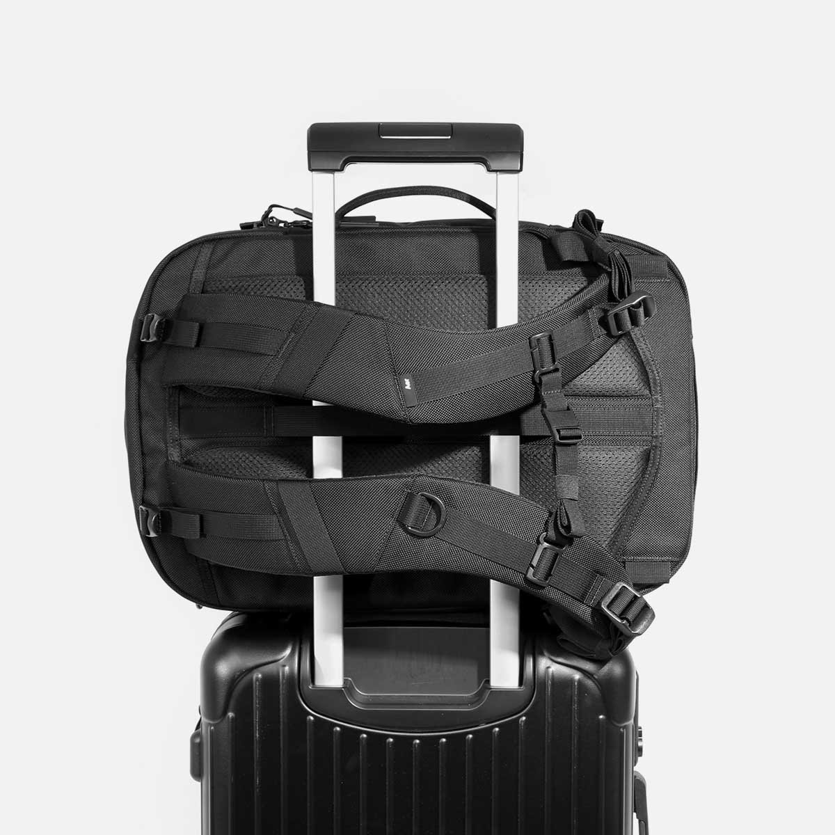 Backpack that slides over luggage handle sale