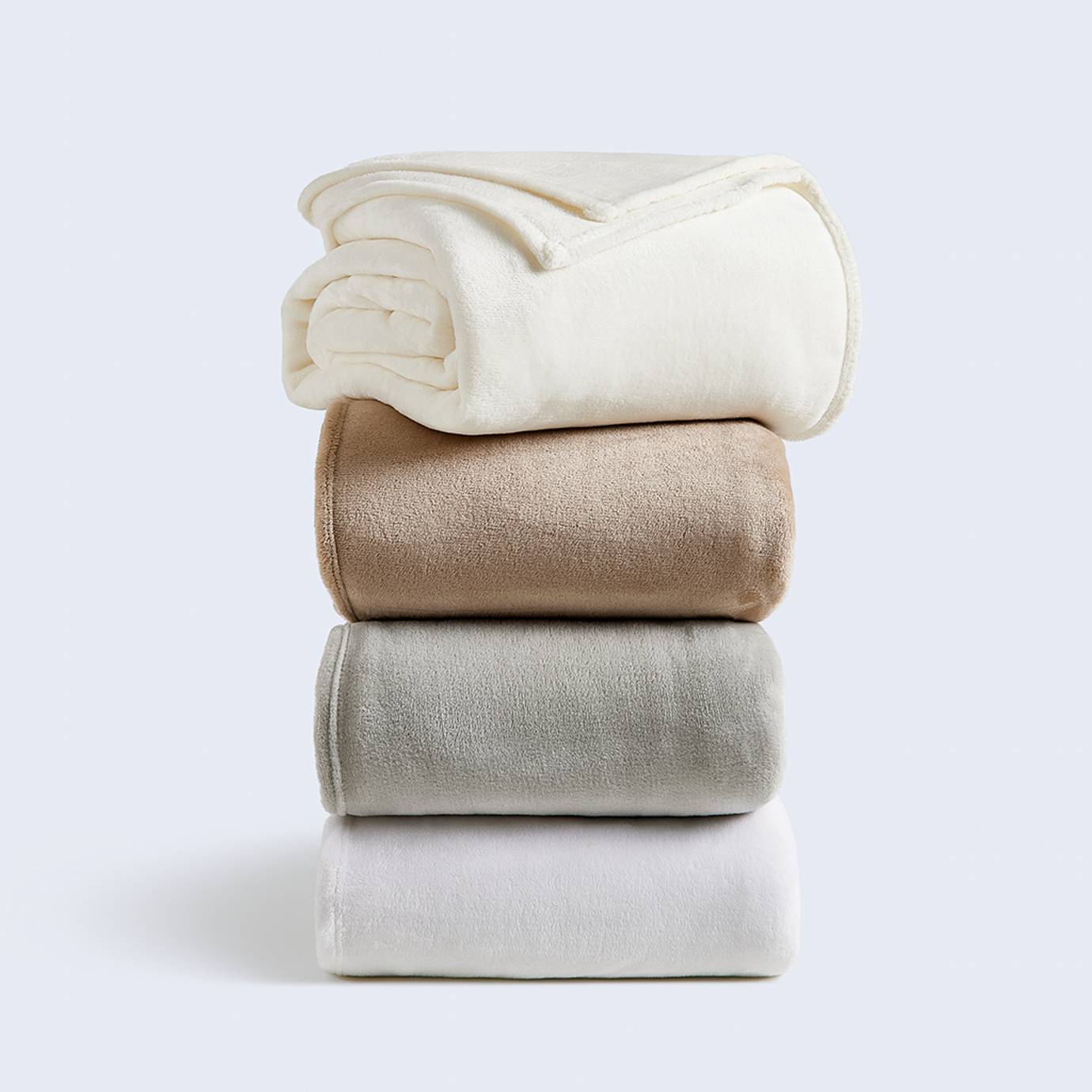 A stack of Cosy House Collection Everyday Fleece Blankets.