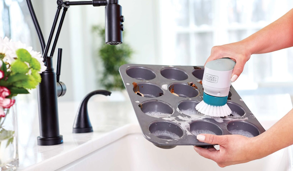 Woman using scrubber on a dirty pan