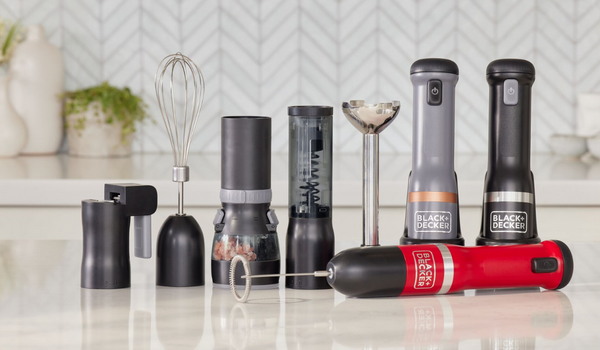 group shot of the kitchen wand in red, gray, and black with can opener, whisk, spice grinder, wine opener, and immersion blender attachments on kitchen island.