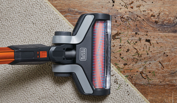 Powerseries extreme cordless stick vacuum cleaner being used to clean floor.