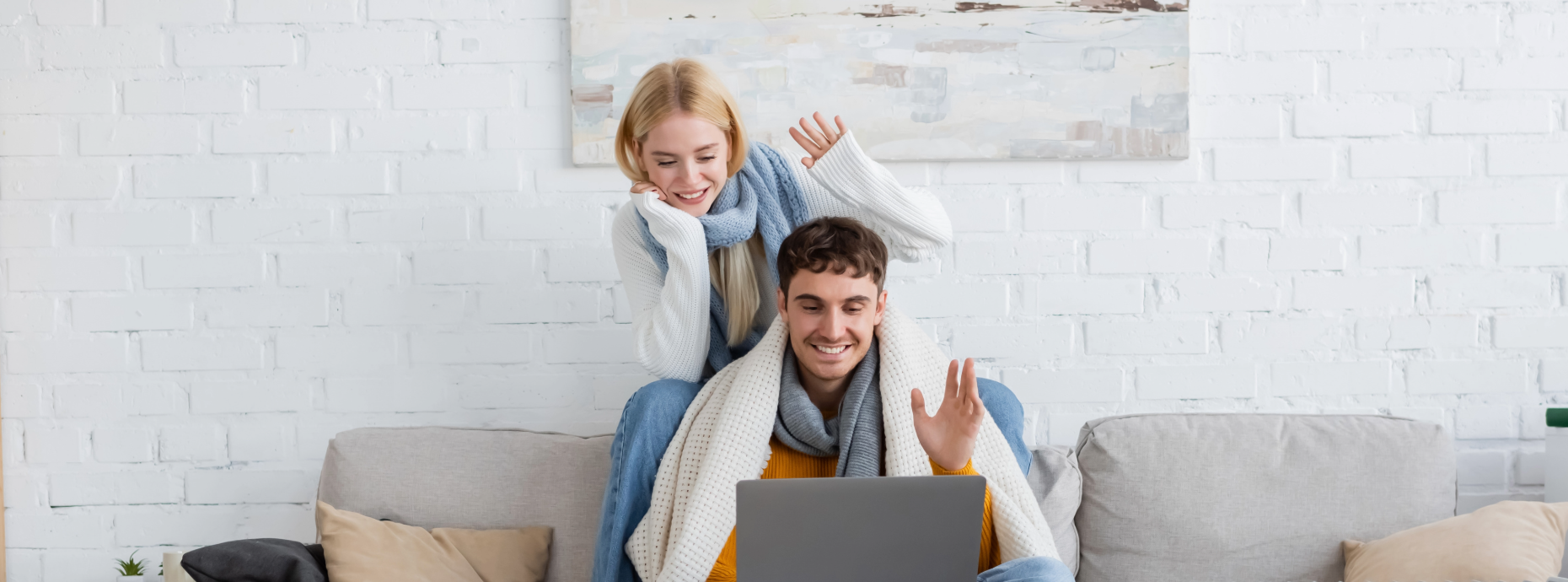 couple chatting online in living room