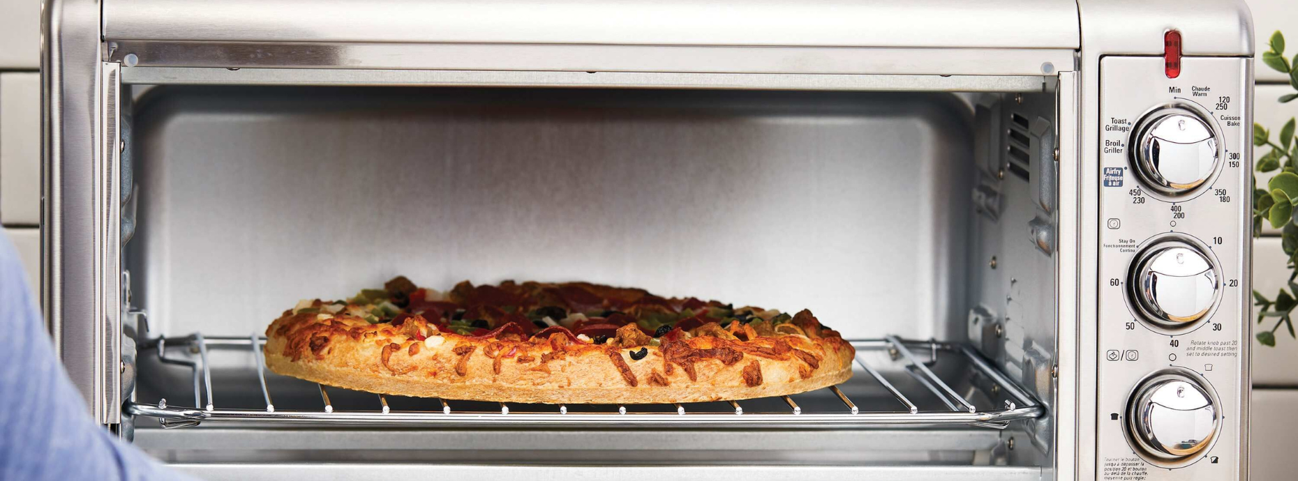 Pizza cooking in a BLACK+DECKER Toaster oven