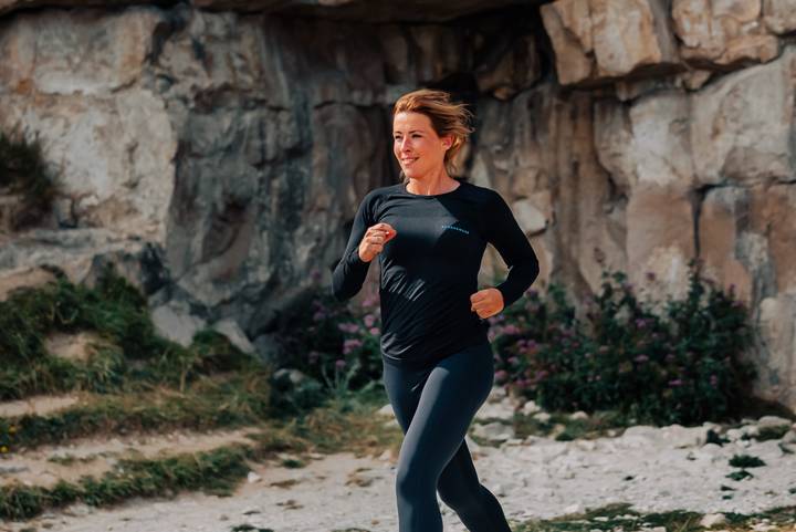 Woman Running In Quarry In Runderwear Black Base Layer