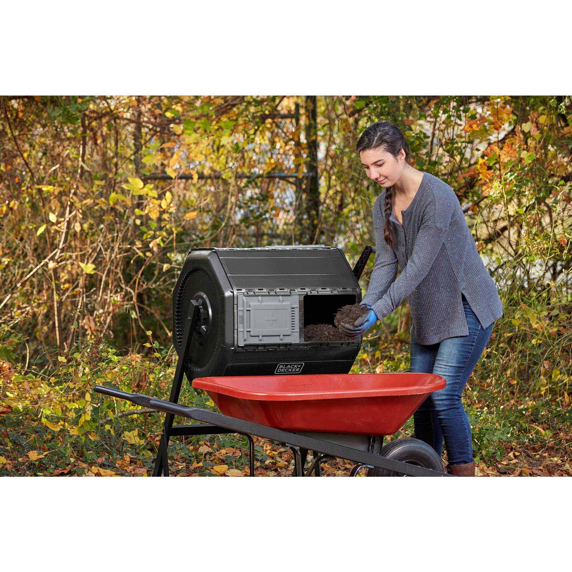 Woman using composter