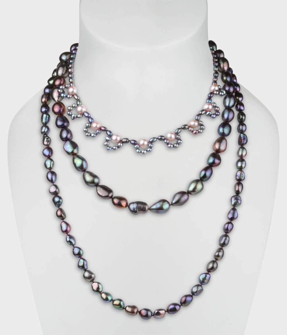 A peacock and pink pearl triple strand necklace from the Coco collection.