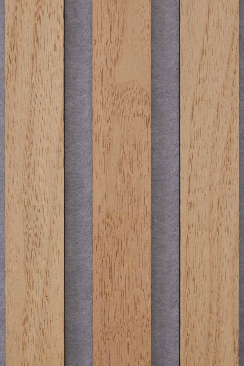 Close up of three oiled Natural Oak slats on a grey felt backing.