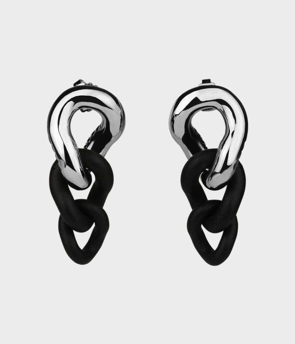 Front view of a pair of silver and black caster seed drop earrings.