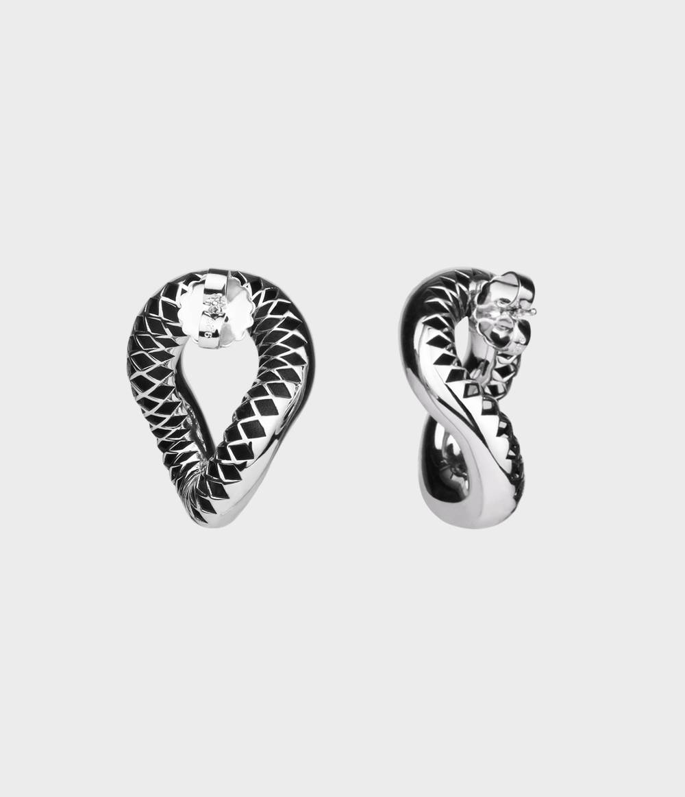 The back and side view of the statement silver earrings from the Raven jewellery collection.
