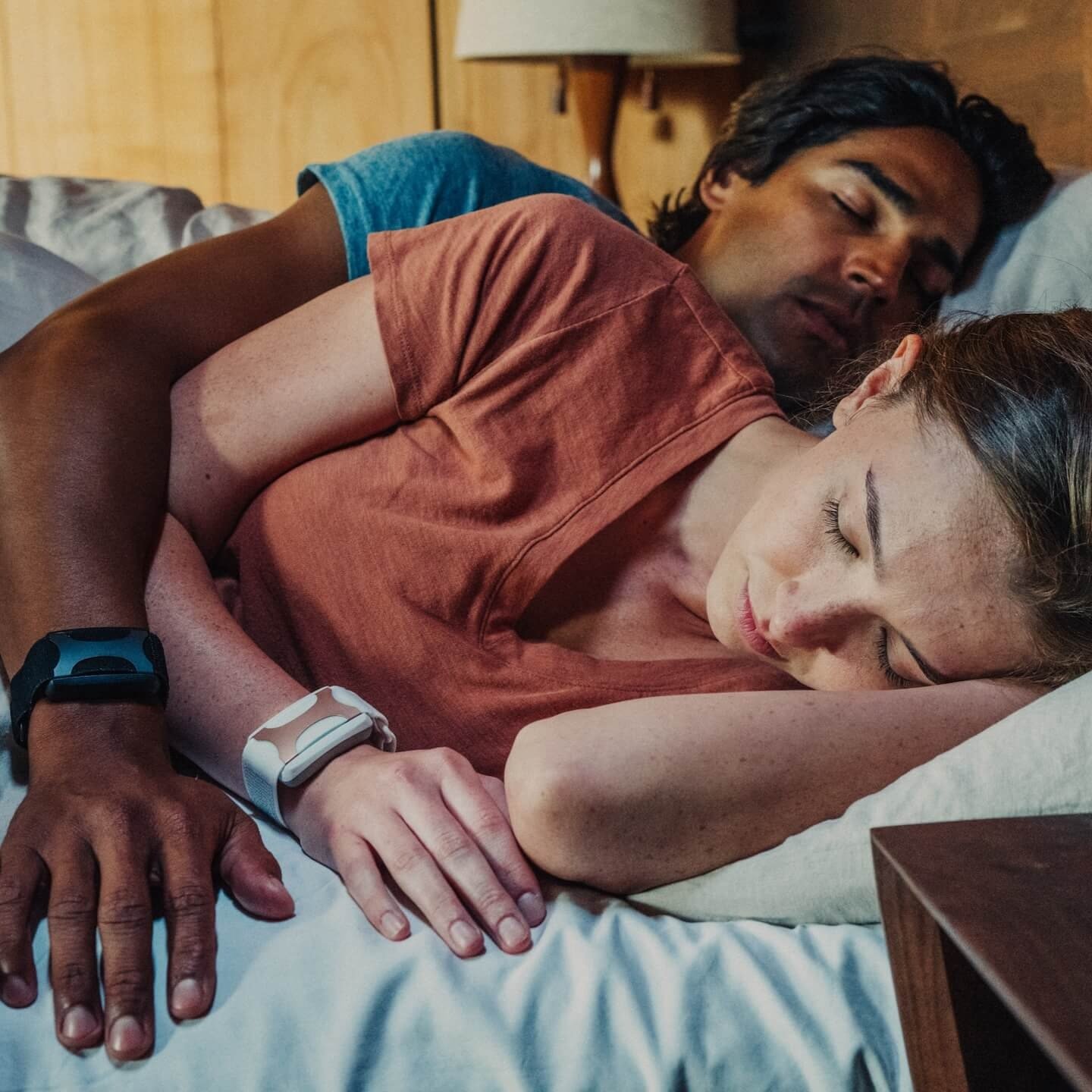 Couple sleeping while wearing Apollo