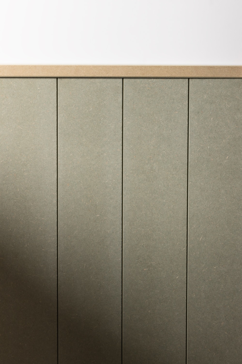 image of a mdf top trim on a wooden wall panel 