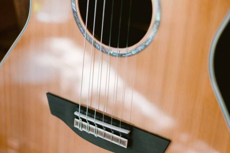 Close-up of nylon strings on Mason Nylon Cedar Live guitar