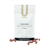 U Perform Active Berries antioxidant berry supplement blend red capsules next to product packaging white pouch