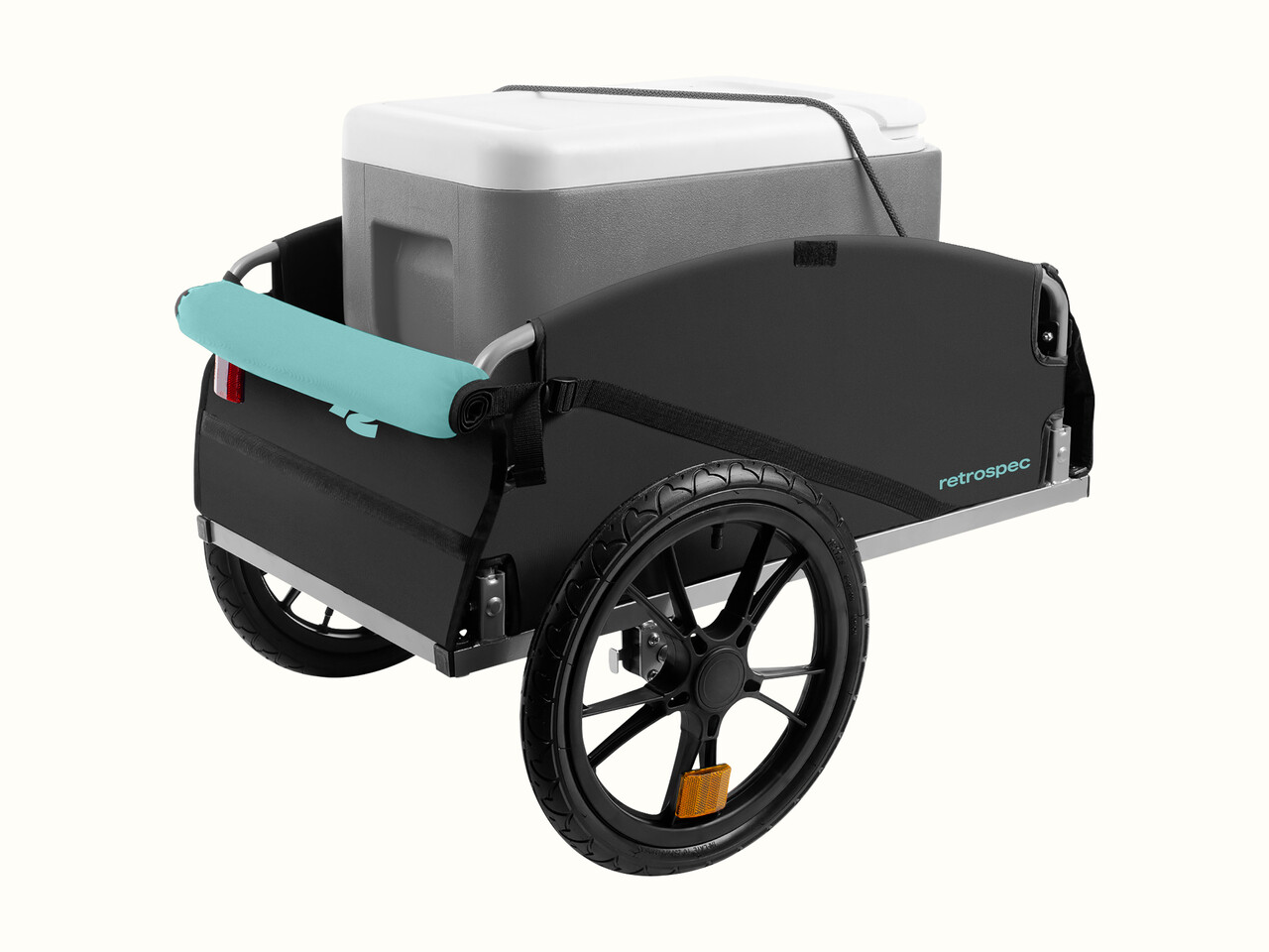 A sleek, black bicycle cargo trailer with two wheels, featuring a gray cooler secured inside and a turquoise handlebar wrap.