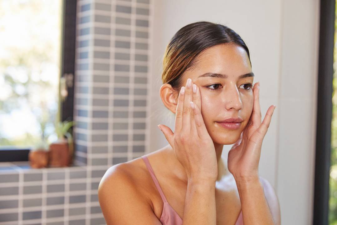 Women cleansing face