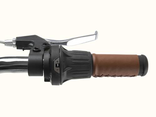 A close up of a brown bike handle with silver hand brake and black gear shifter.