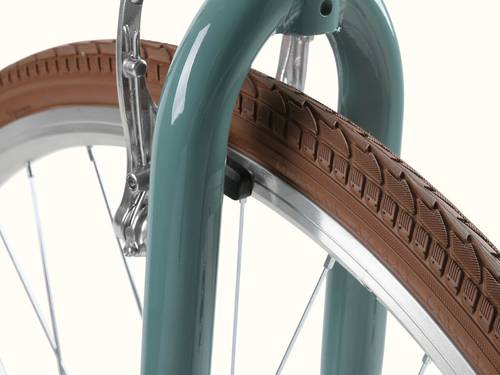 Close-up of the Kinney Mixte City Bike - 7 Speed's brown tire.