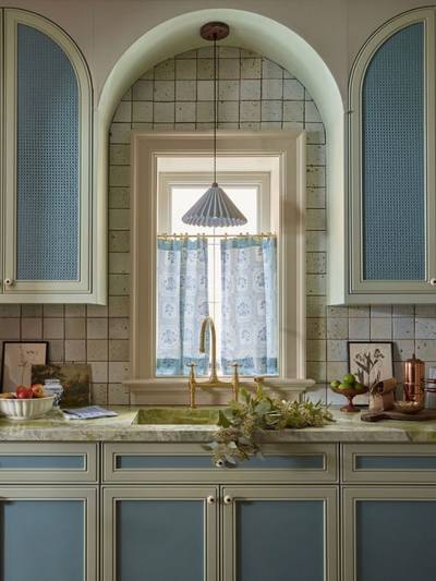clé tile terracotta eastern elements rice paper tiles installed on a kitchen backsplash with blue cabinets