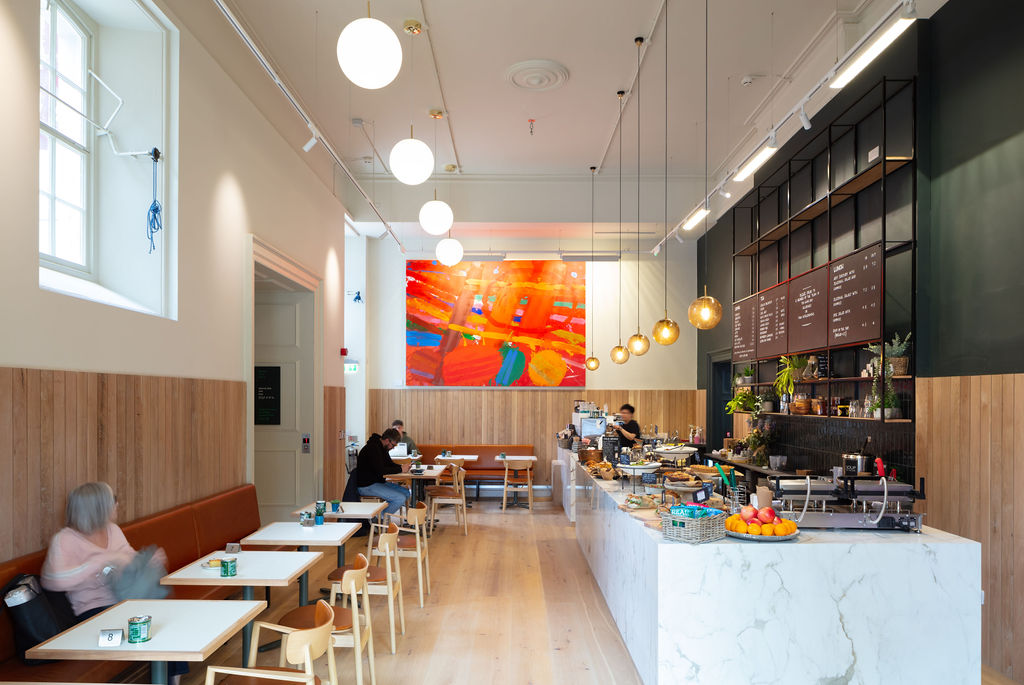 The new cafe in the RWA building with a large food counter and seating 