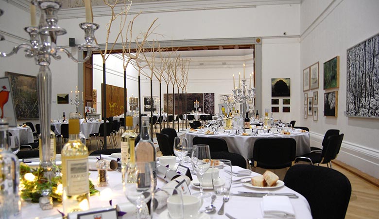 Tables are decorated in the RWA galleries for an event 