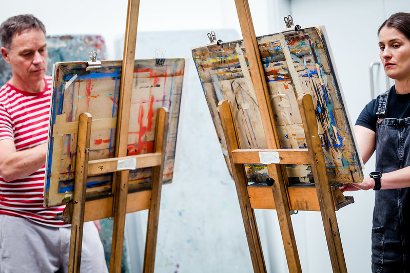 Two Drawing School students drawing at easels in the new Art Studio 