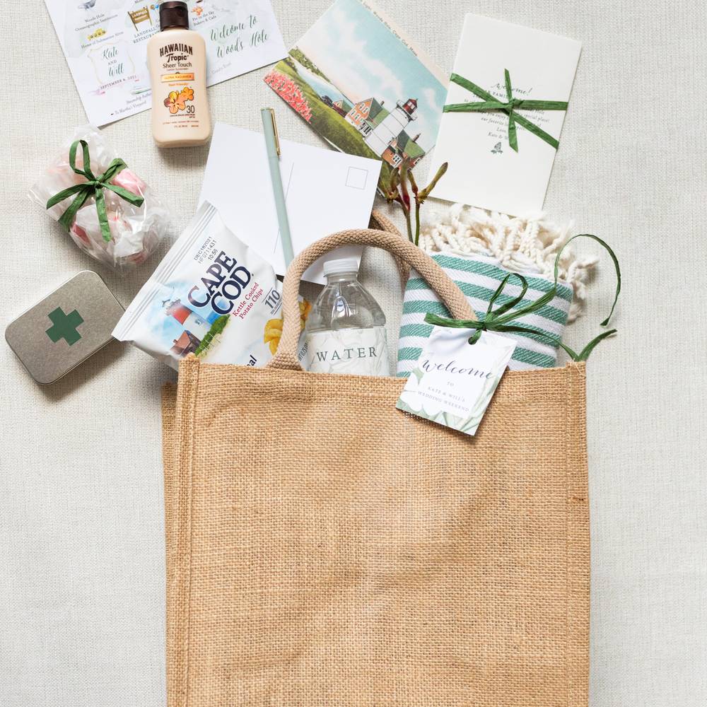 Jute gift bag with Comeback Kit, Water, Chips, Postcard, Pen, Salt Water Taffy, Turkish Cotton Beach Towel, and Sunscreen
