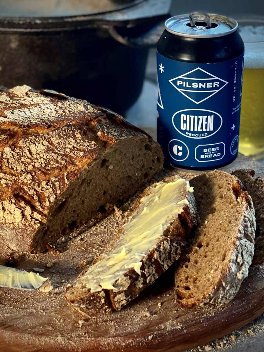 Ironclad sourdough bread made with Citizen Pilsner, served sliced with butter.