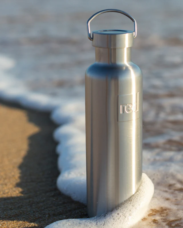 Red Original insulated stainless steel water bottle on the beach