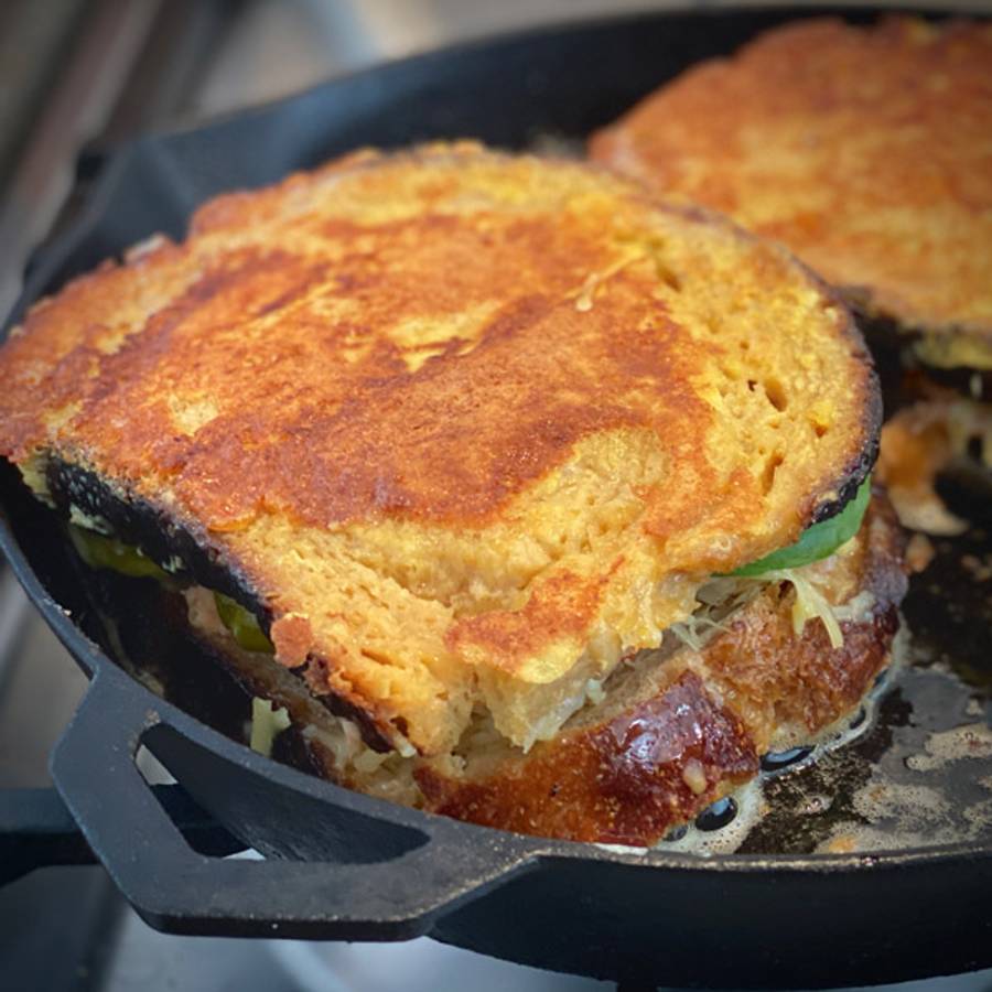 Frying salmon french toasted sandwich in the Ironclad Legacy Pan