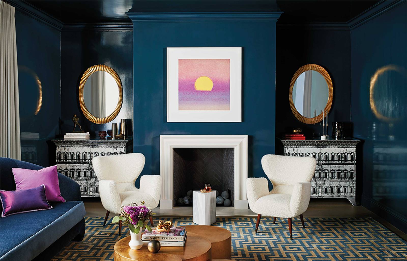 A deep blue sitting room with fireplace/Photography: James Carriere/Designed by McCaffrey Design Group for a Pacific Heights, San Francisco home, this fireplace area features Benjamin Moore’s Stunning on the walls and a moody atmosphere.