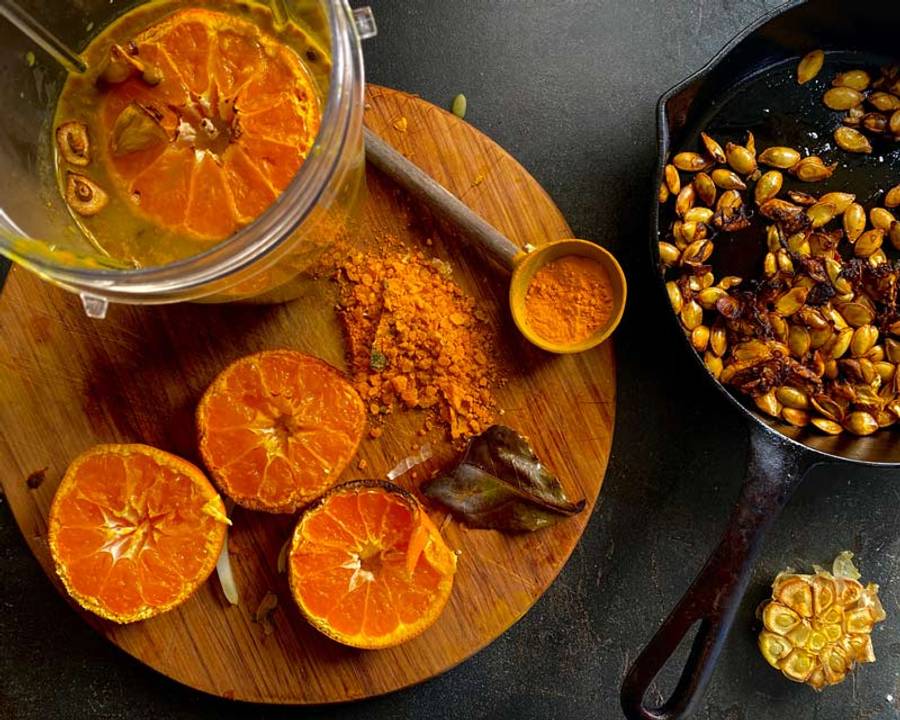 Spice mix and coconut milk mix ready to be added to roasted pumpkin