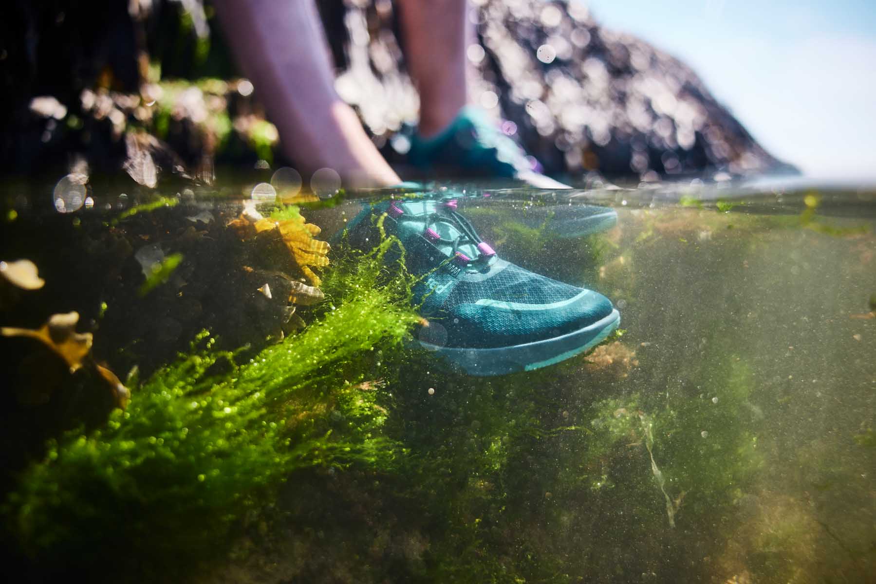 Blue aqua shoes submerged under water