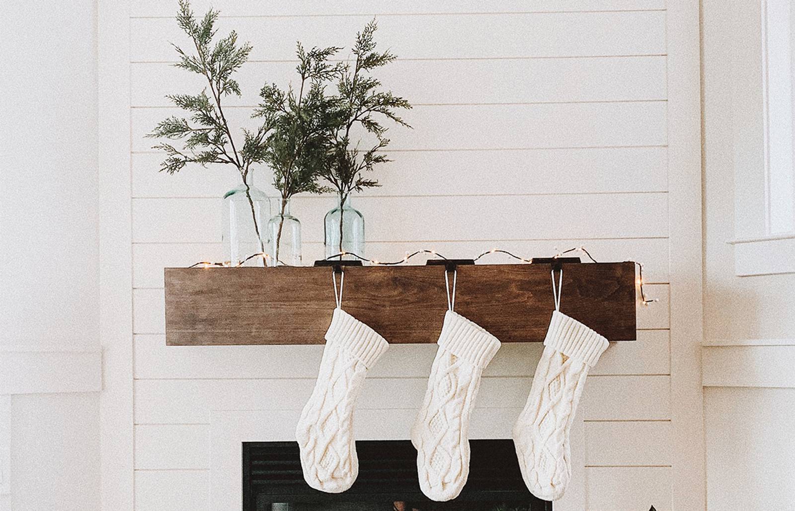White stockings hanging on mantle/Photography: Genevieve Rusnac/A minimalistic, near-monochromatic look is always in style.