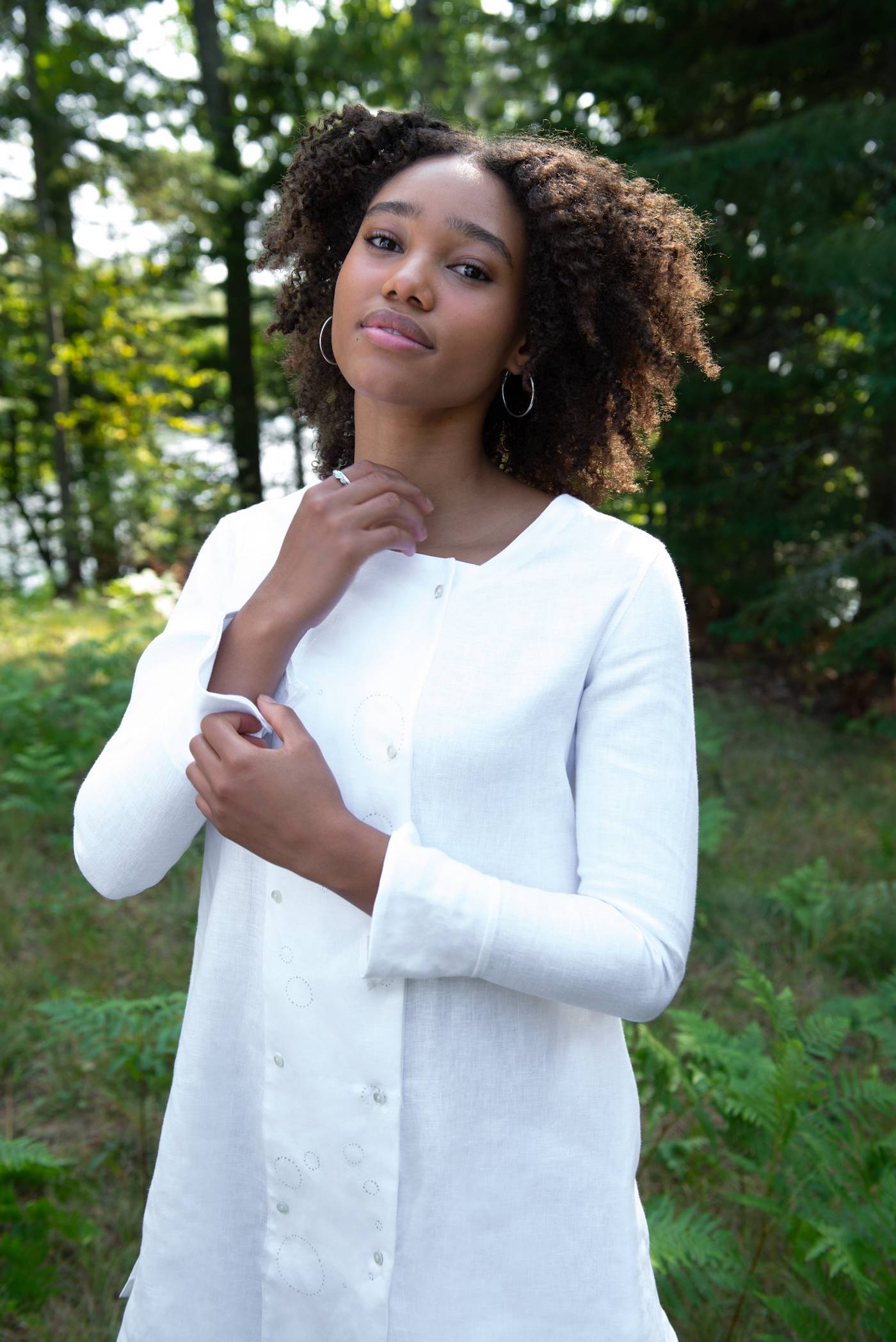 Sophi modeling the white Medulla tunic in a forest setting