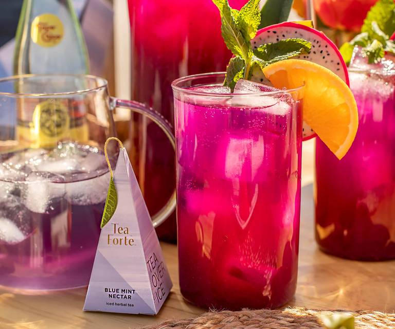 Glass of Blue Mint Dragonfruit Lemonade with pyramid infuser