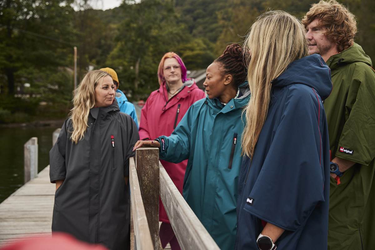 6 people wearing Red Paddle Pro Change Robe Evos at the Lake district